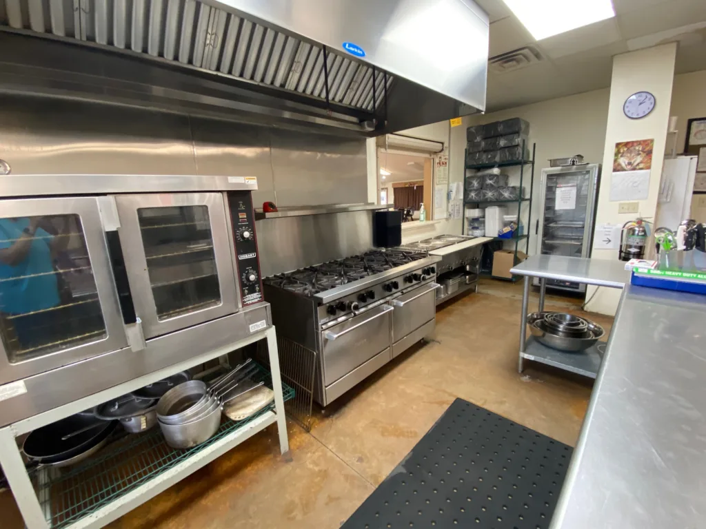 Commercial Kitchen complete with convection oven, stove and serving station with window